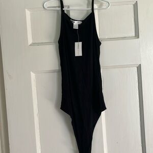 Urban Heritage, black body suit. New with tags. Snap bottom.